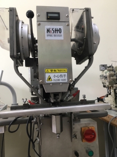 Button press machine