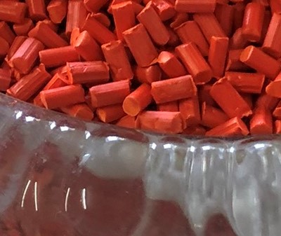 Orange red plastic pellets