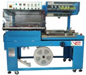Shrink wrapping machine