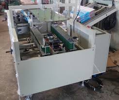 Automatic carton opening and bottom gluing machine