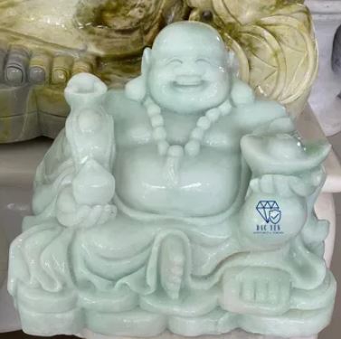 Monolithic white stone Maitreya statue