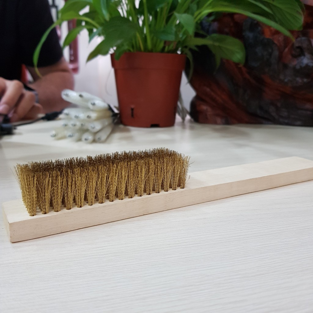 Brass wire brush with wooden handle