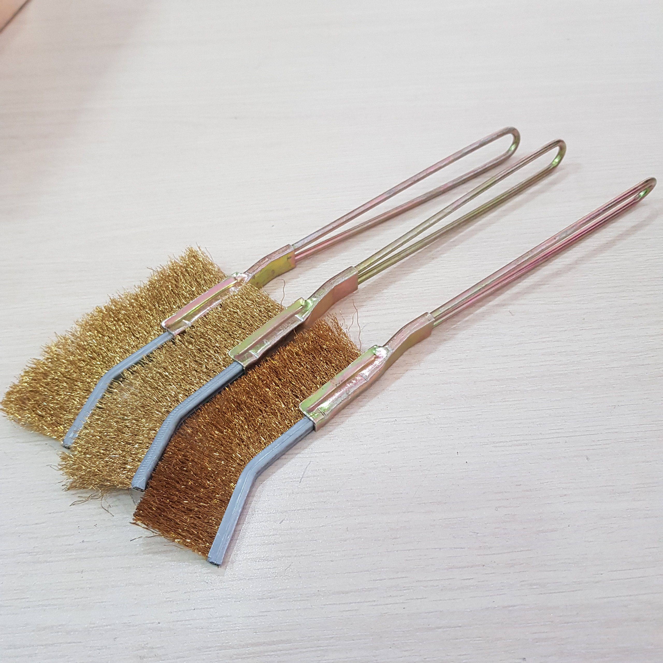 Brass wire brush with steel handle