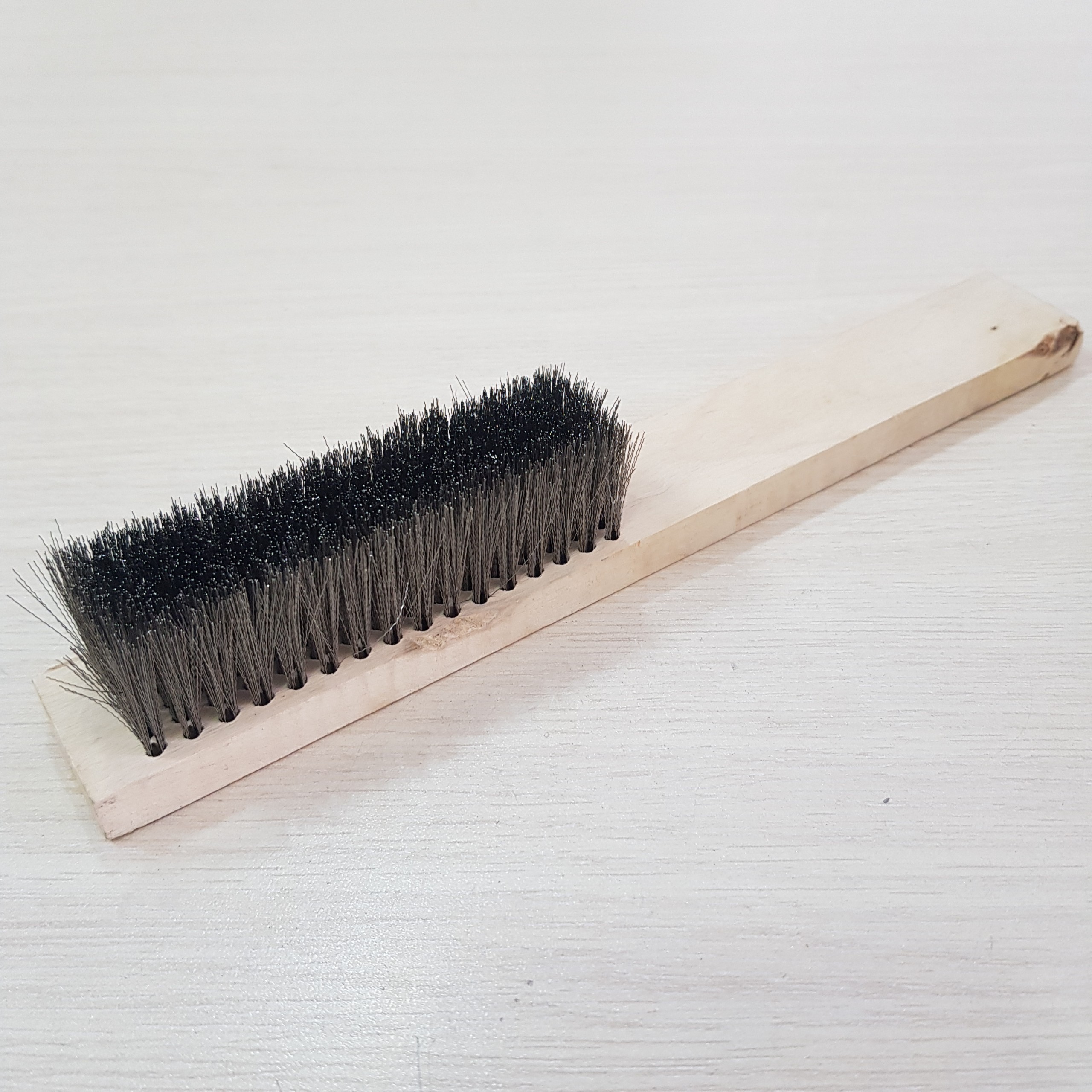 Stainless steel wire brush with wooden handle
