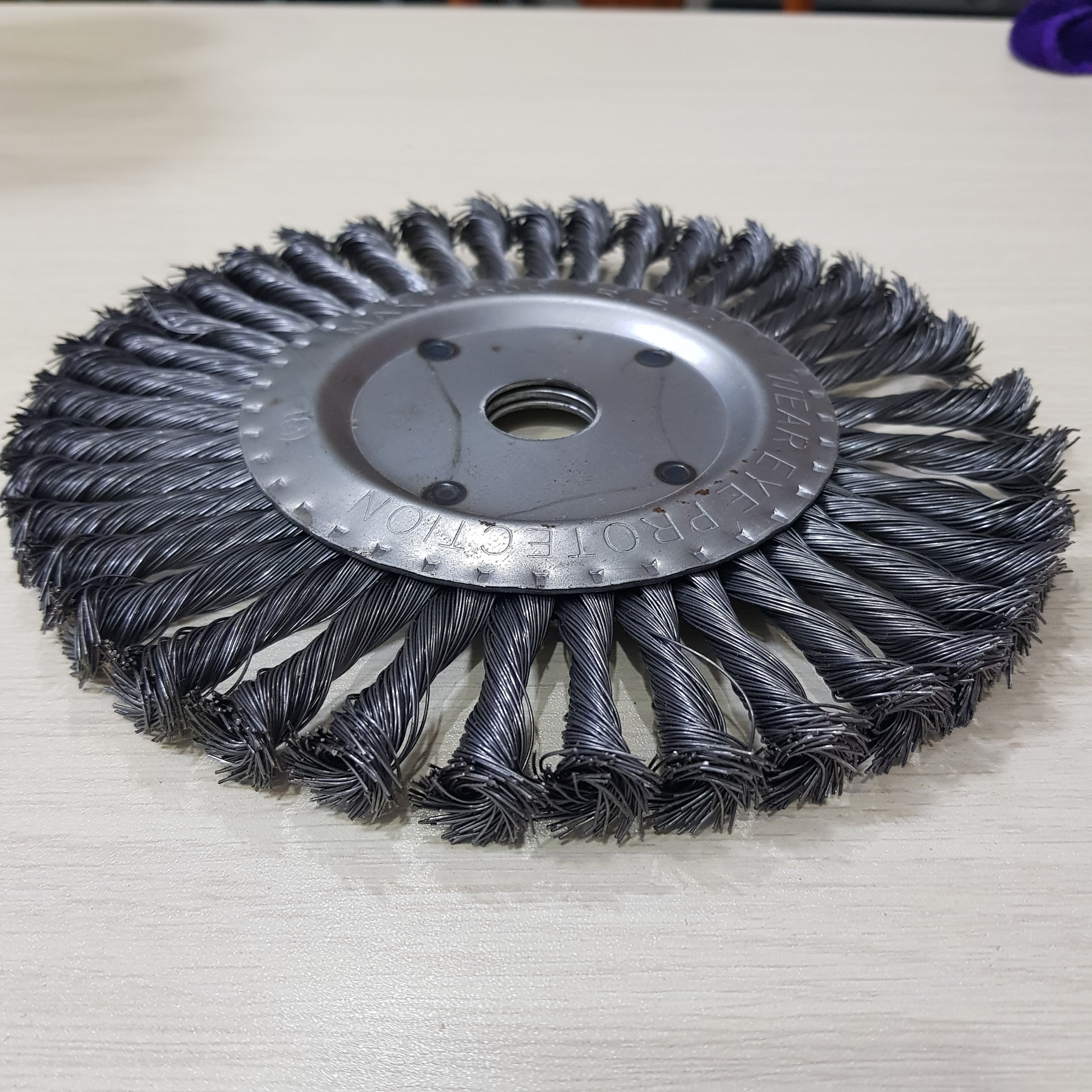 Twisted wire wheel brush