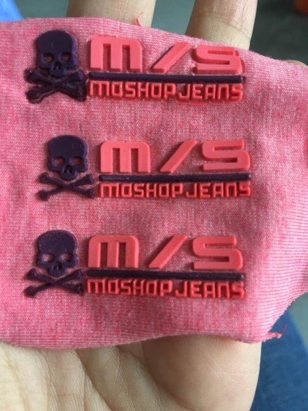 Embossed logo label