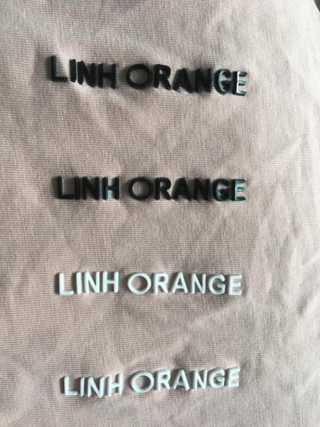 Embossed logo label