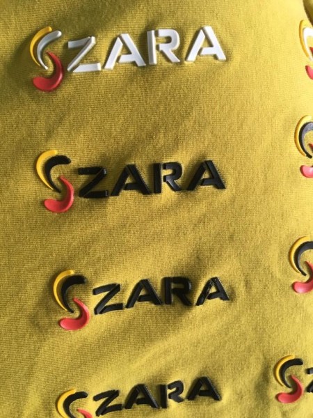 Embossed logo label