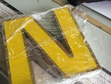 Brass and stainless steel signs