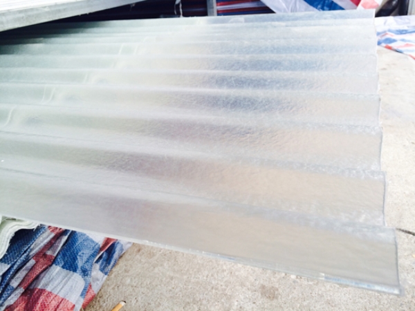 Composite plastic roofing sheet