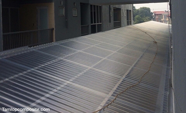 Composite plastic roofing sheet