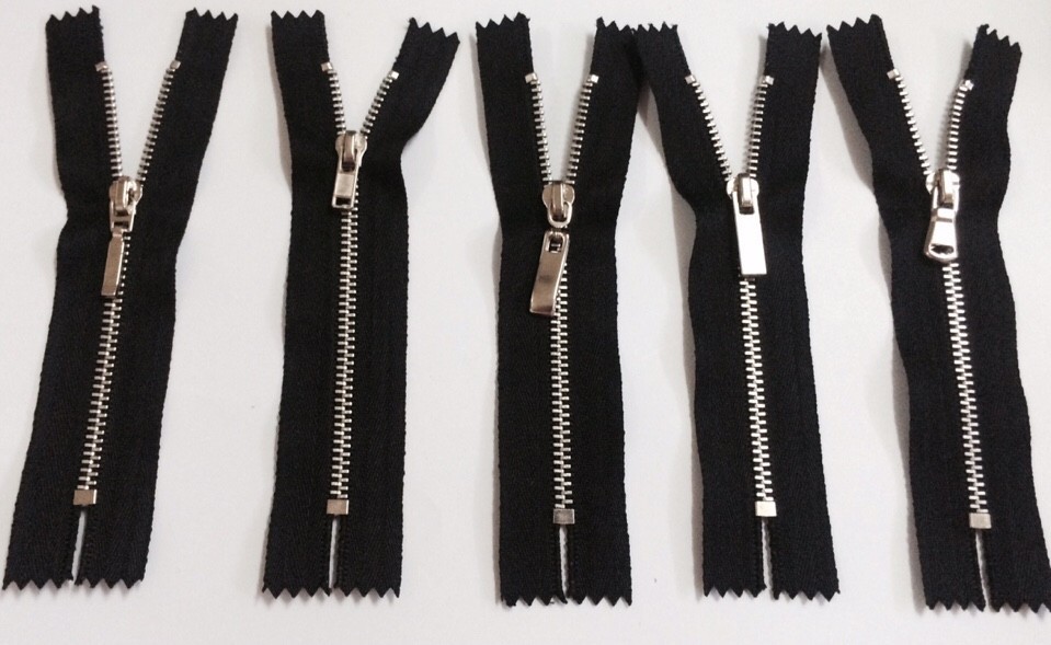 Shiny silver zippers