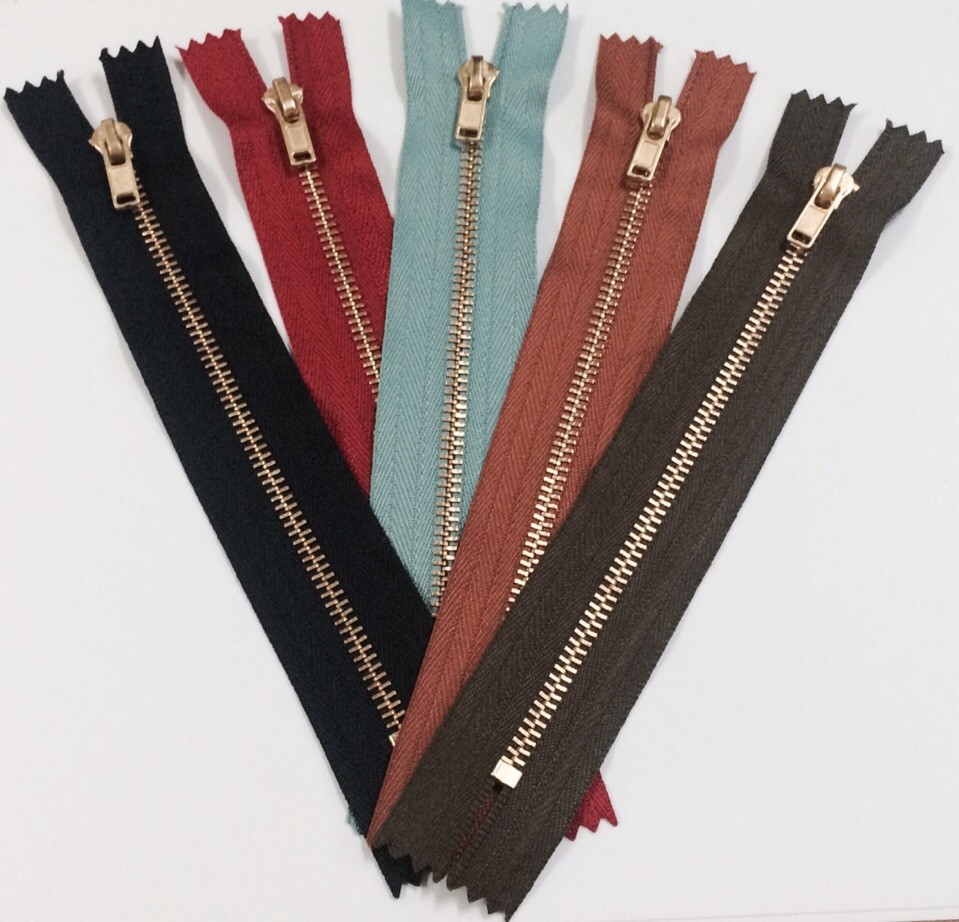 Shiny gold zippers
