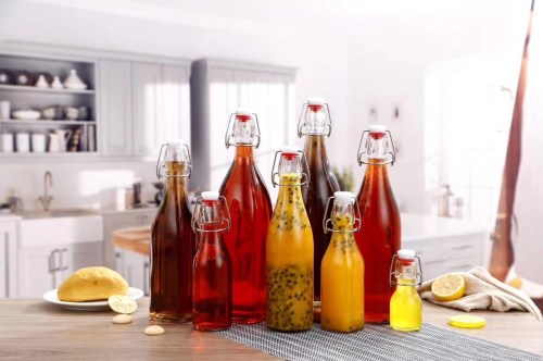Round glass bottle with clip top