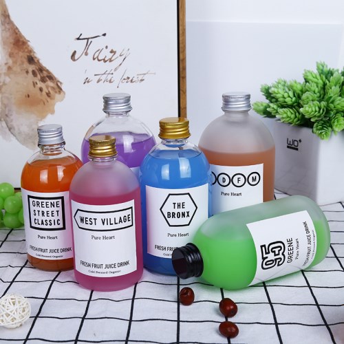 Round glass bottle with aluminum cap