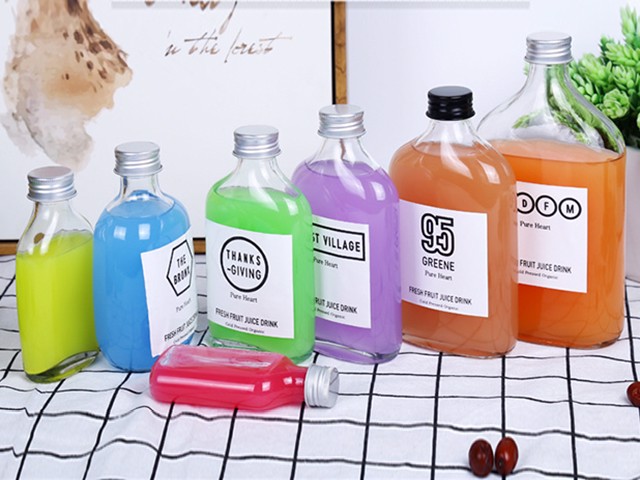 Flat glass bottle with aluminum cap