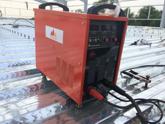 Deck floor stud welding machine