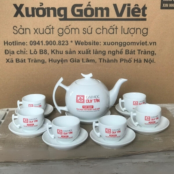 White porcelain tea sets with Duy Tan University logo