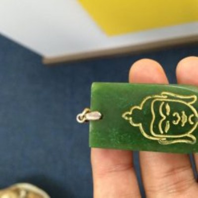 Buddha-shaped pendant