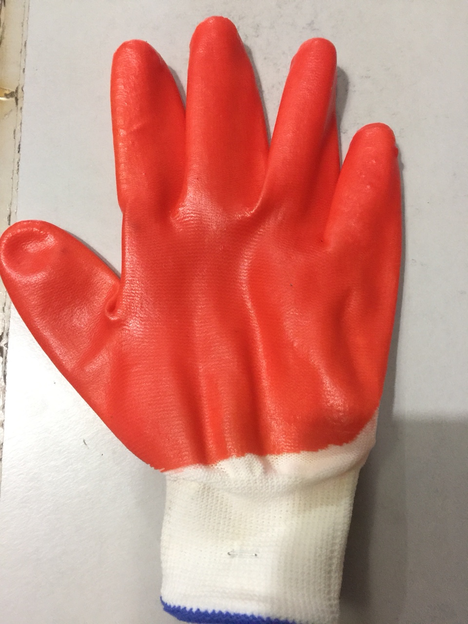 Gloves with yellow plastic dots