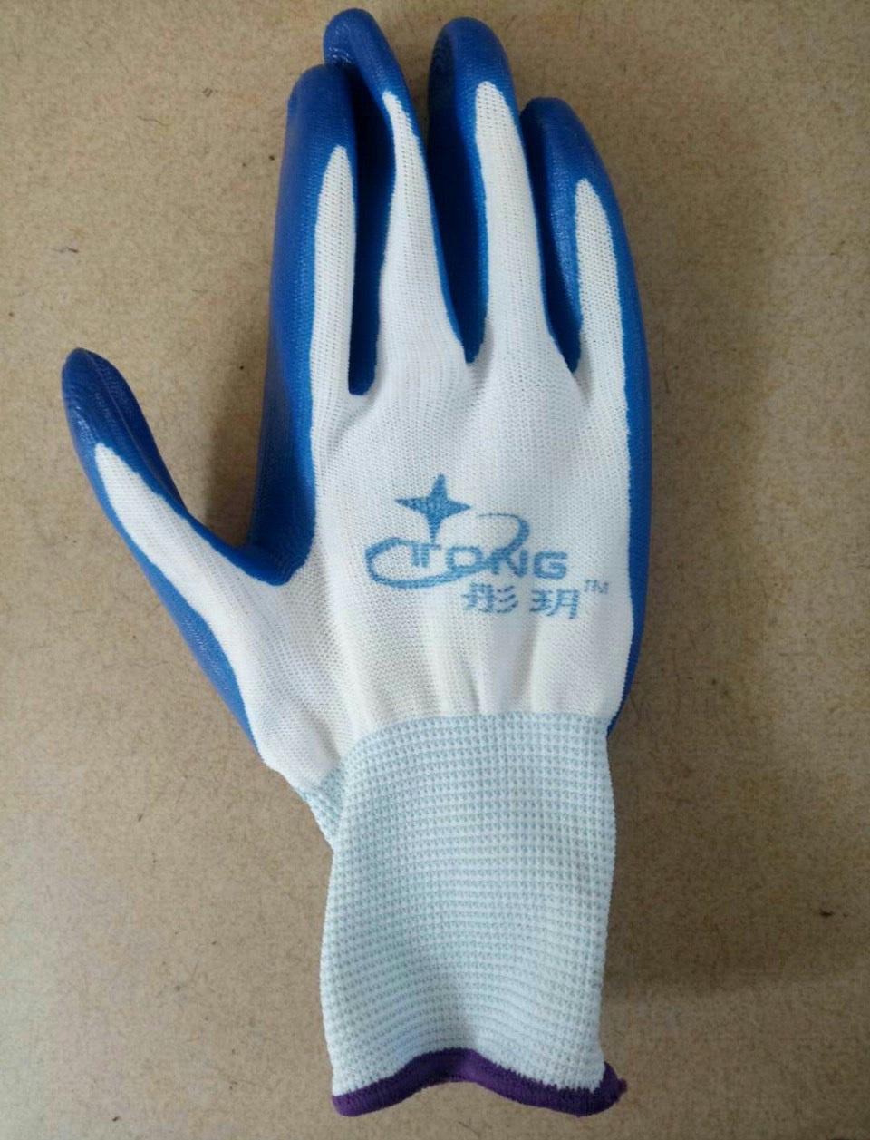 Gloves with green plastic dots