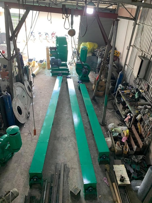 Rotary valve, screw conveyor, and belt conveyor