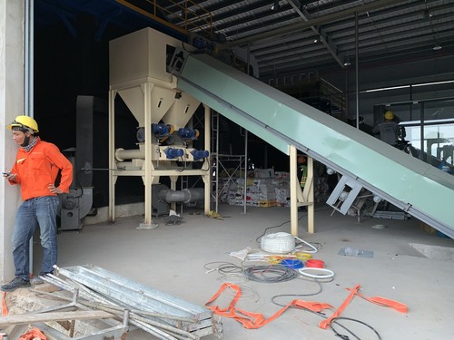 Rotary valve, screw conveyor, and belt conveyor