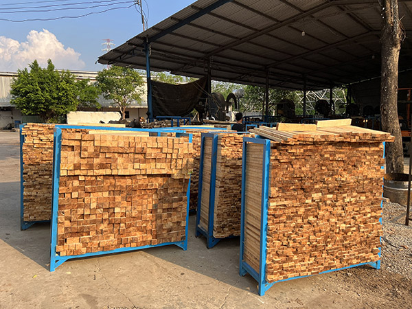 Fresh wood billets are prepared for drying