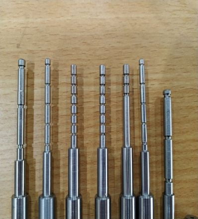 Aligning punch for rubber bar