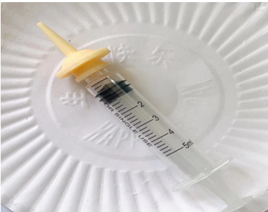 Pacifiers attached syringe