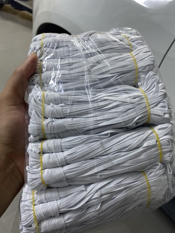 Woven button hole elastic band