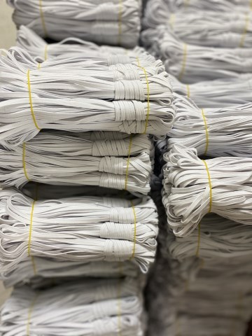 Woven button hole elastic band