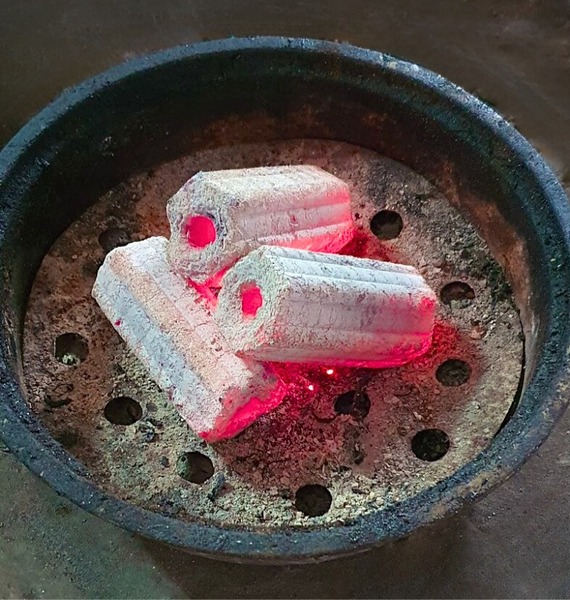 Compressed charcoal hexagonal briquettes
