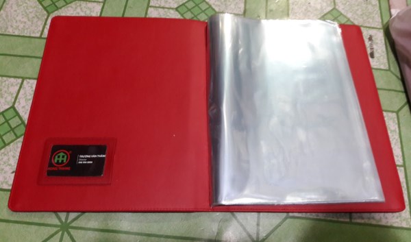 Leather holder with clear plastic sheets